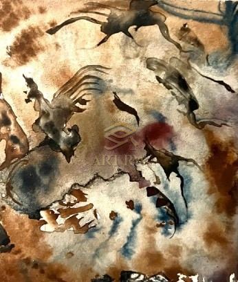 On a background of textured, dark bronze, a golden-winged emblem relief with detailed feathers and a central circular design is displayed.